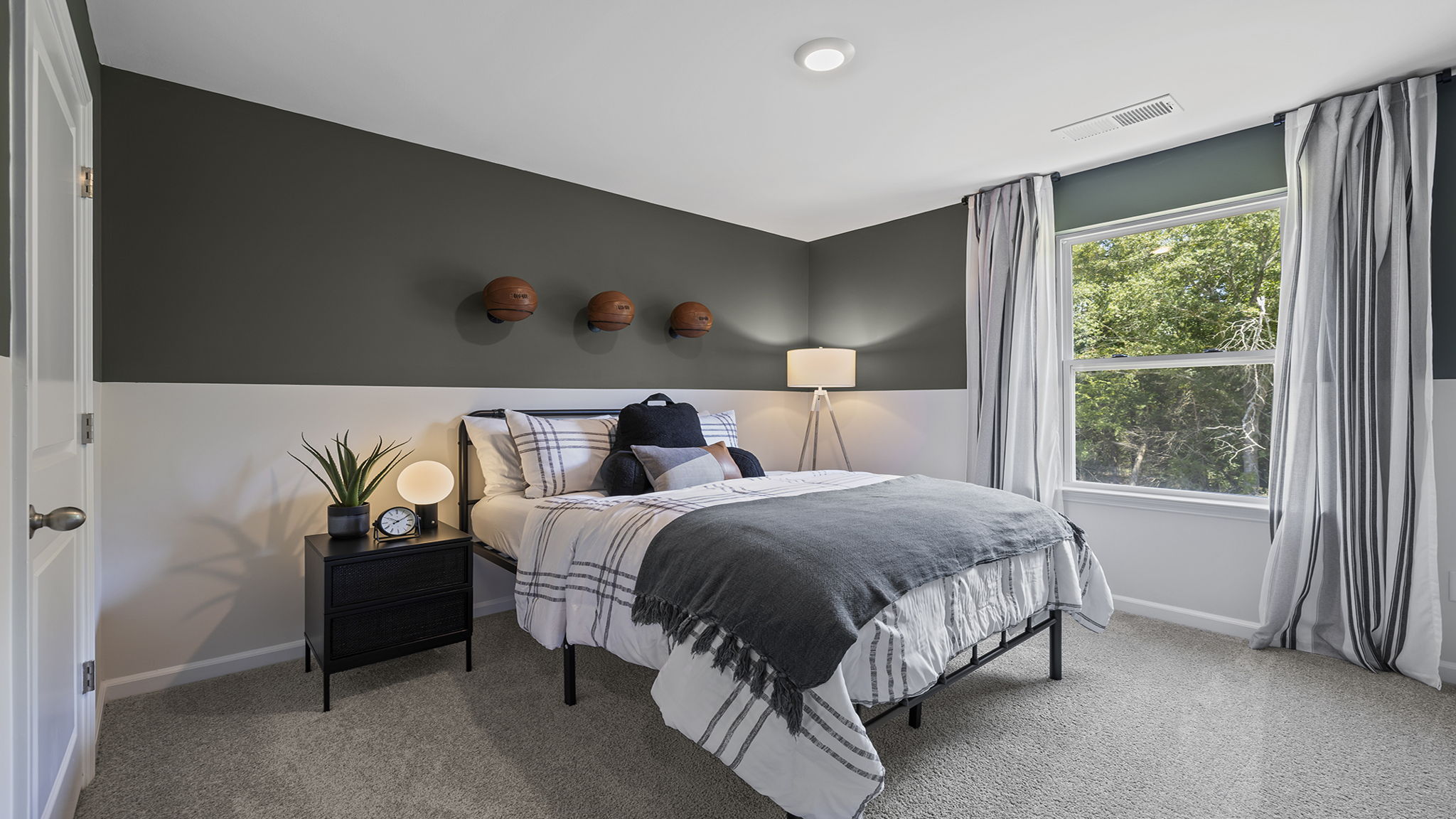 Bedroom with carpet and windows.
