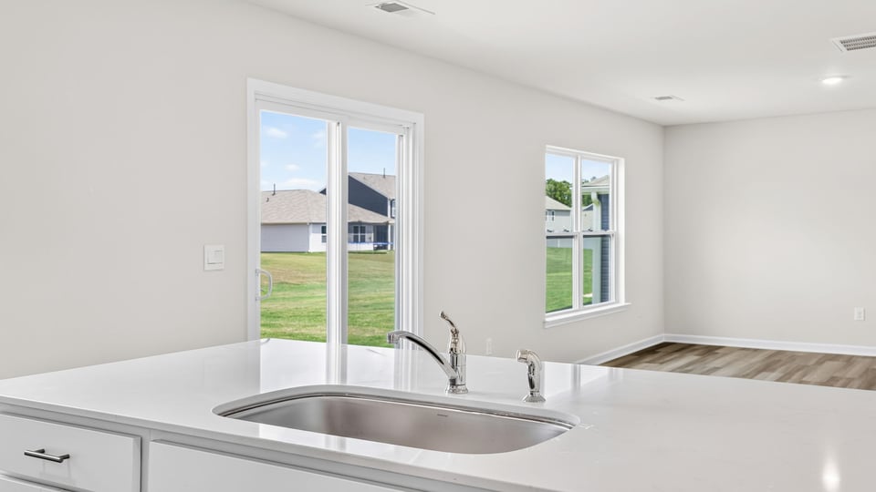 Kitchen with island and cabinets.