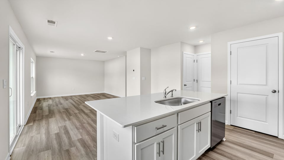 Kitchen with island and cabinets.