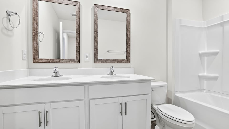 Bathroom with double vanity sinks.