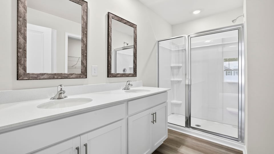 Primary bathroom with double vanity sinks.