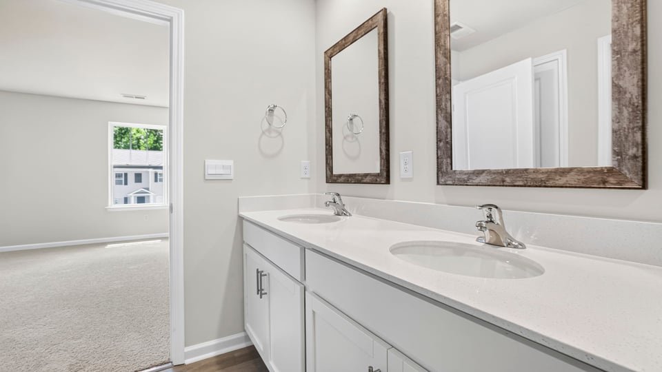 Primary bathroom with double vanity sinks.