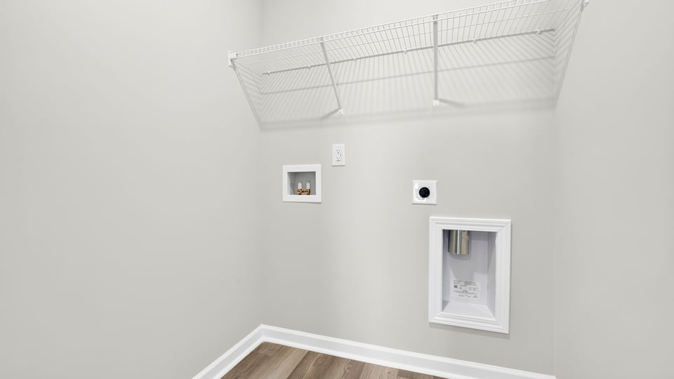 Laundry room with shelf.