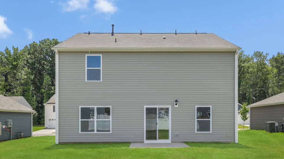 Back exterior with large backyard.