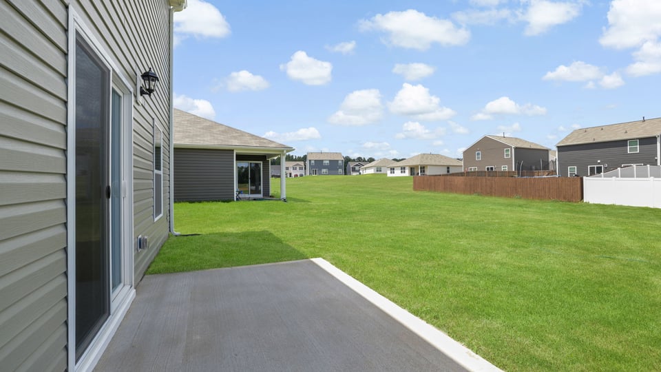 Back exterior with large backyard.