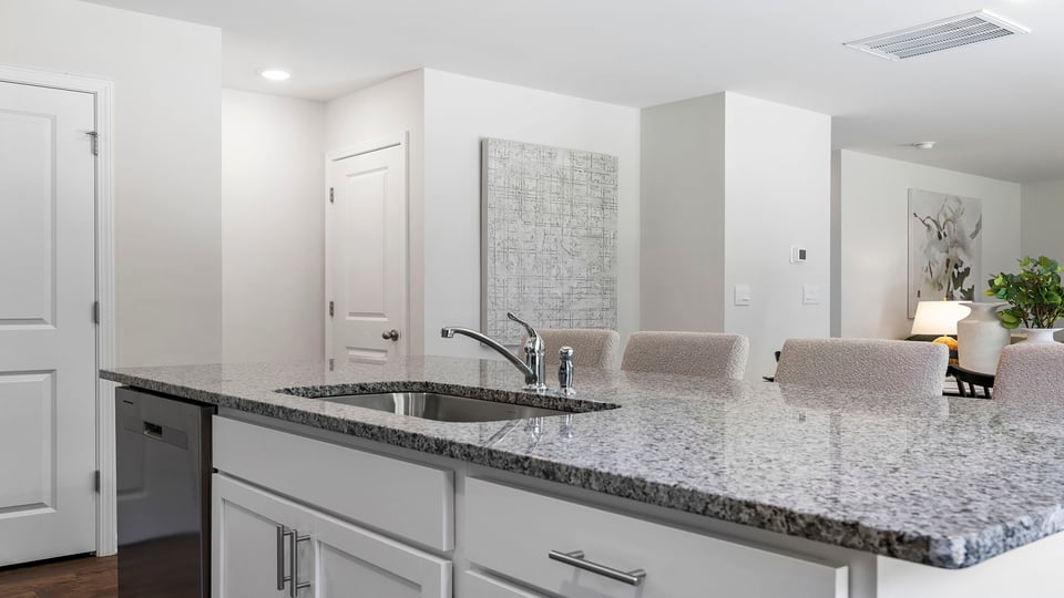 Kitchen with island and cabinets.
