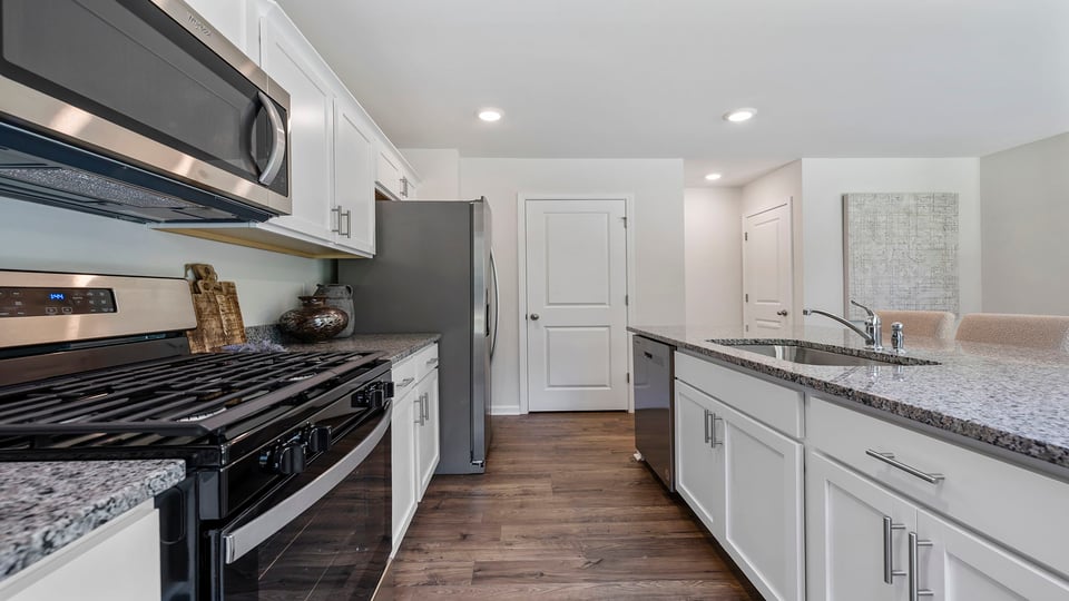 Kitchen with island and cabinets.