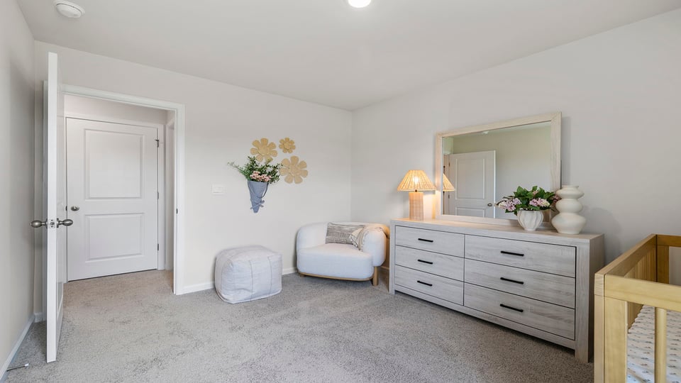 Bedroom with carpet and windows,