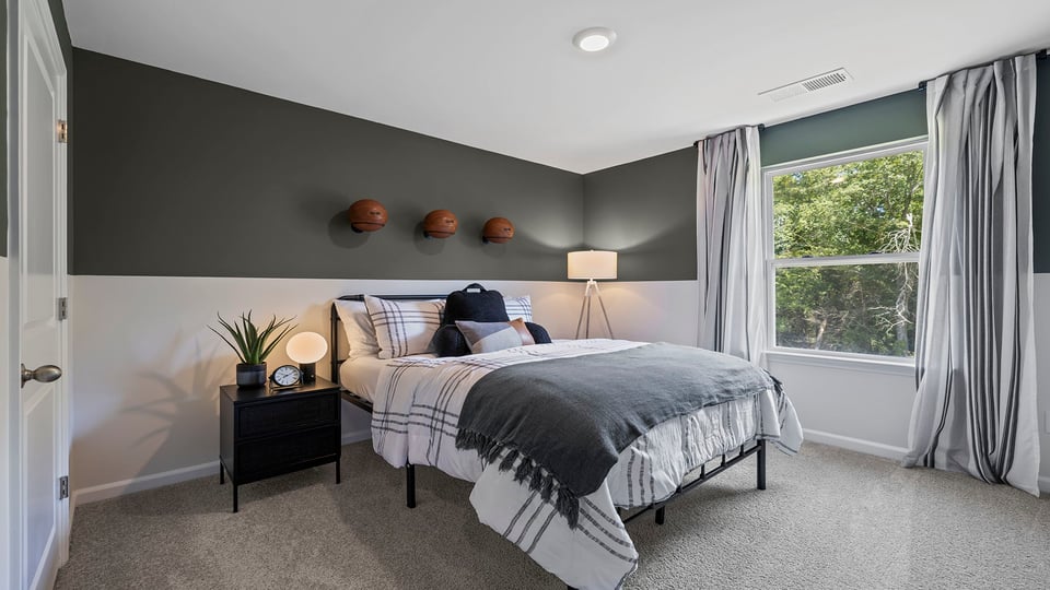 Bedroom with carpet and windows,