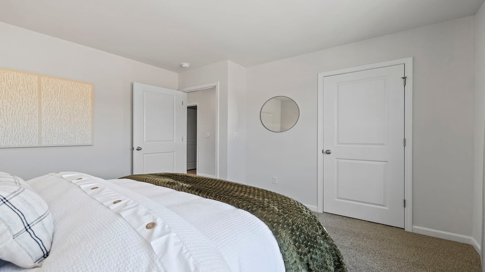Bedroom with carpet and windows,
