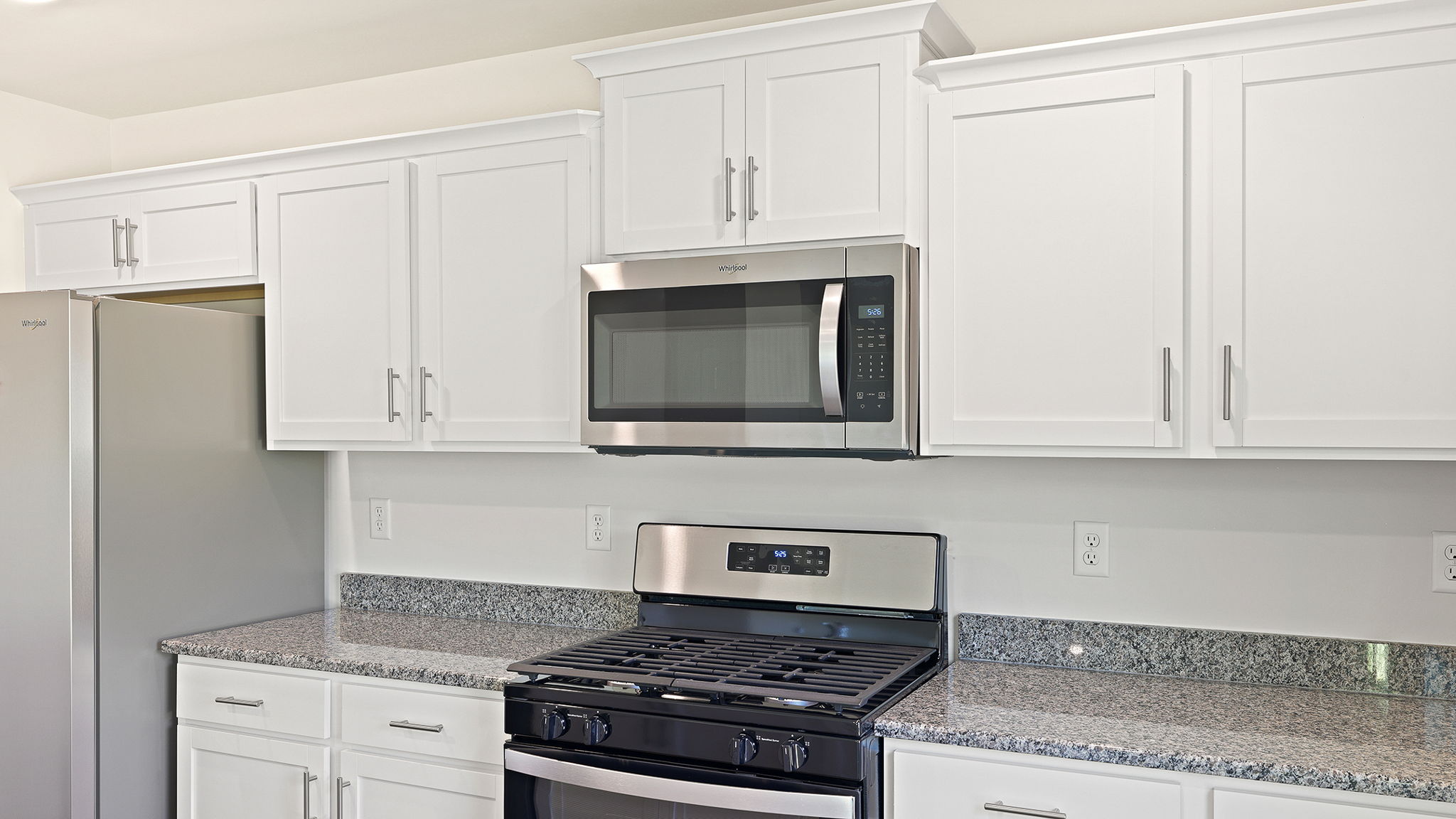 Kitchen area with granite  and stainless-steel appliances