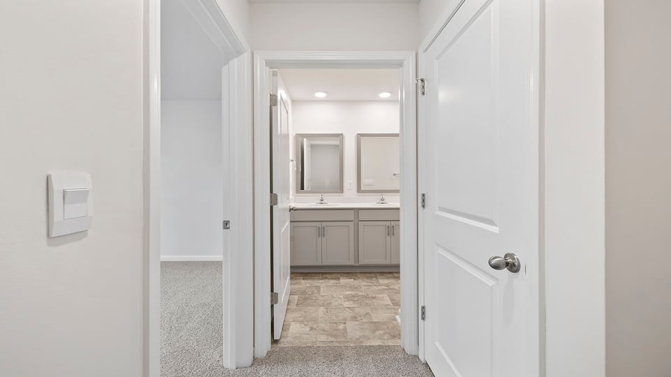 Upper hallway with view of hall bathroom.