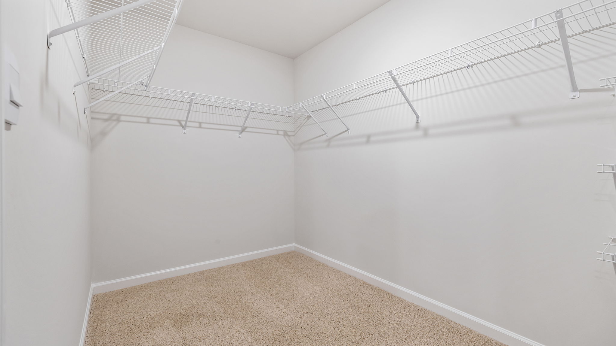 Primary bedroom walk-in closet.