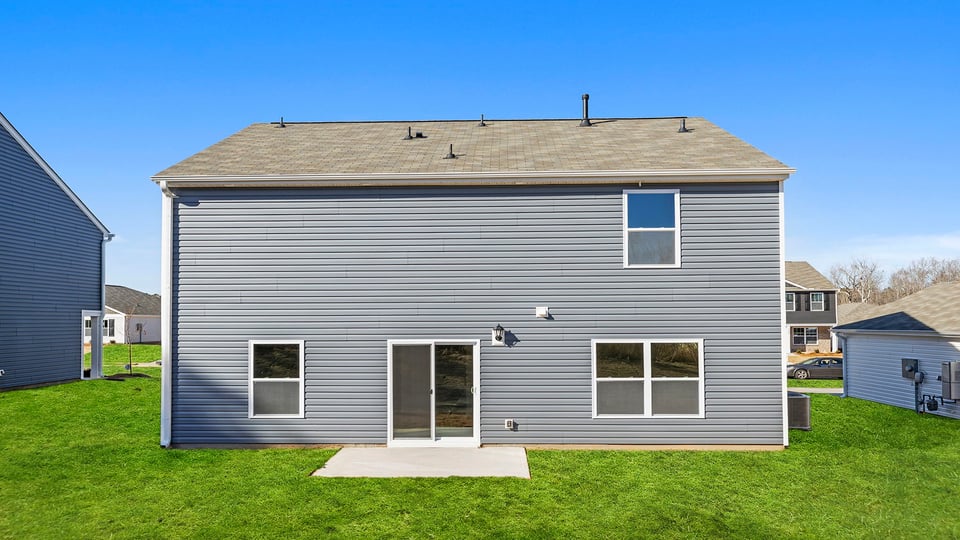 Back exterior of the Belhaven with patio.