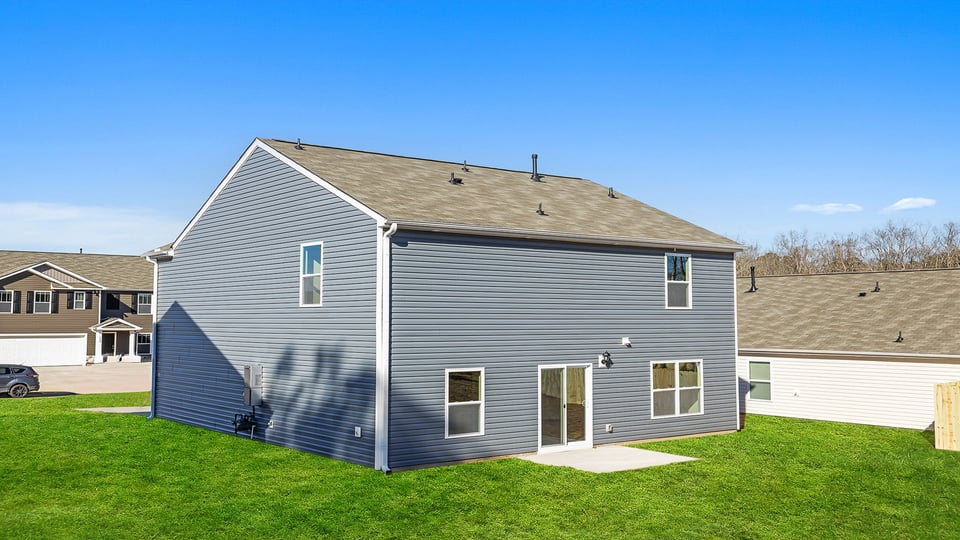 Back exterior of the Belhaven with patio.