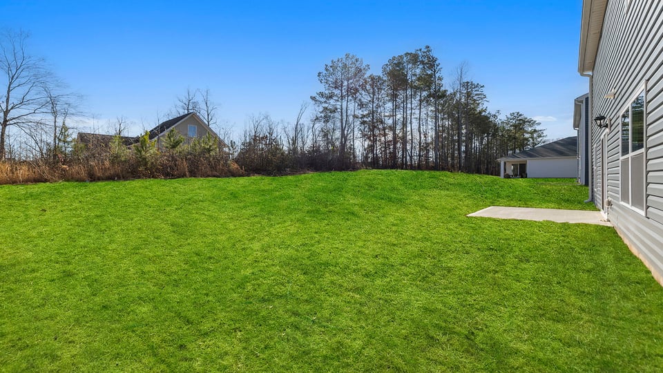 Back exterior of the Belhaven with patio.
