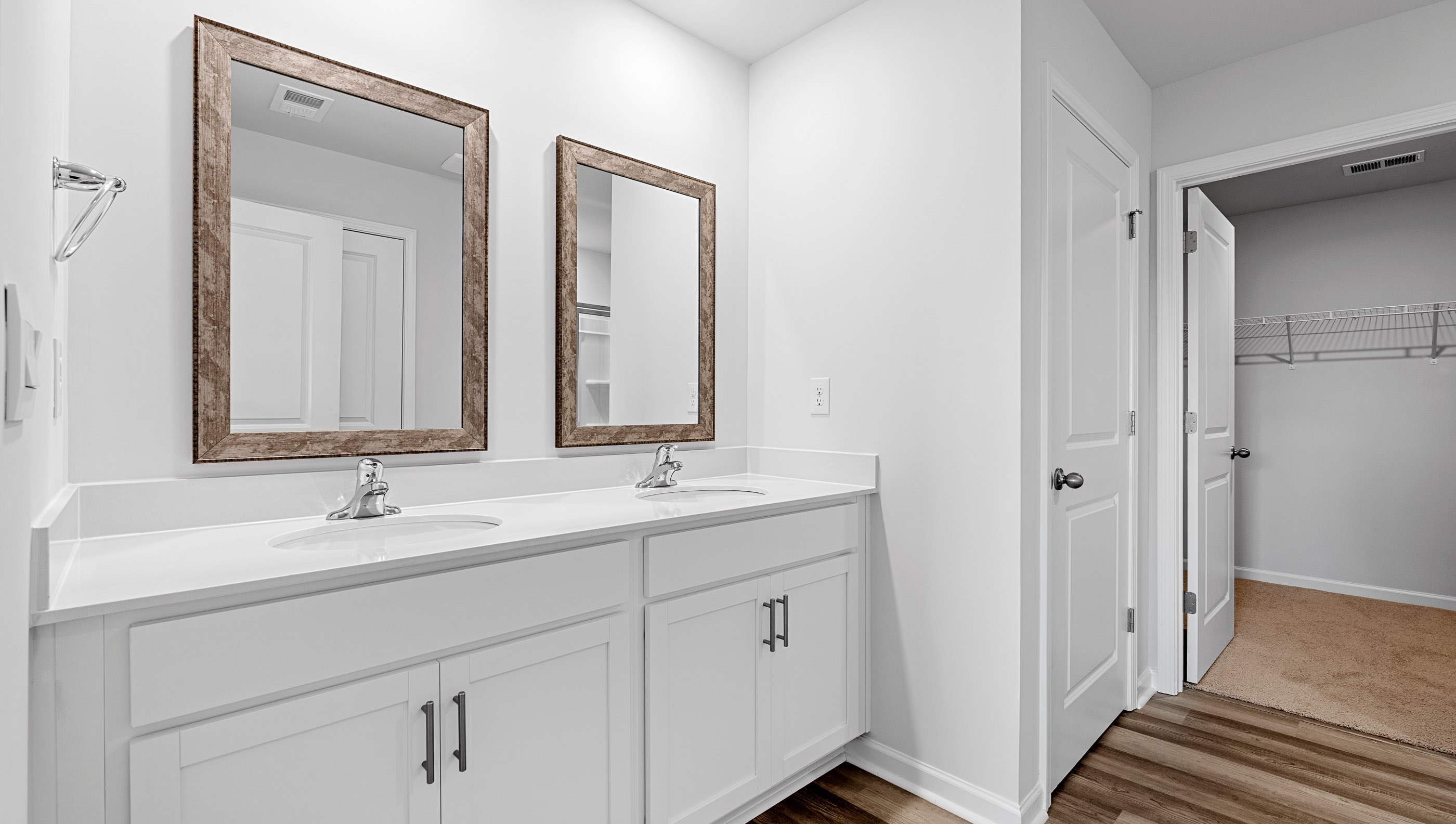 Primary bathroom with dual sink vanity.