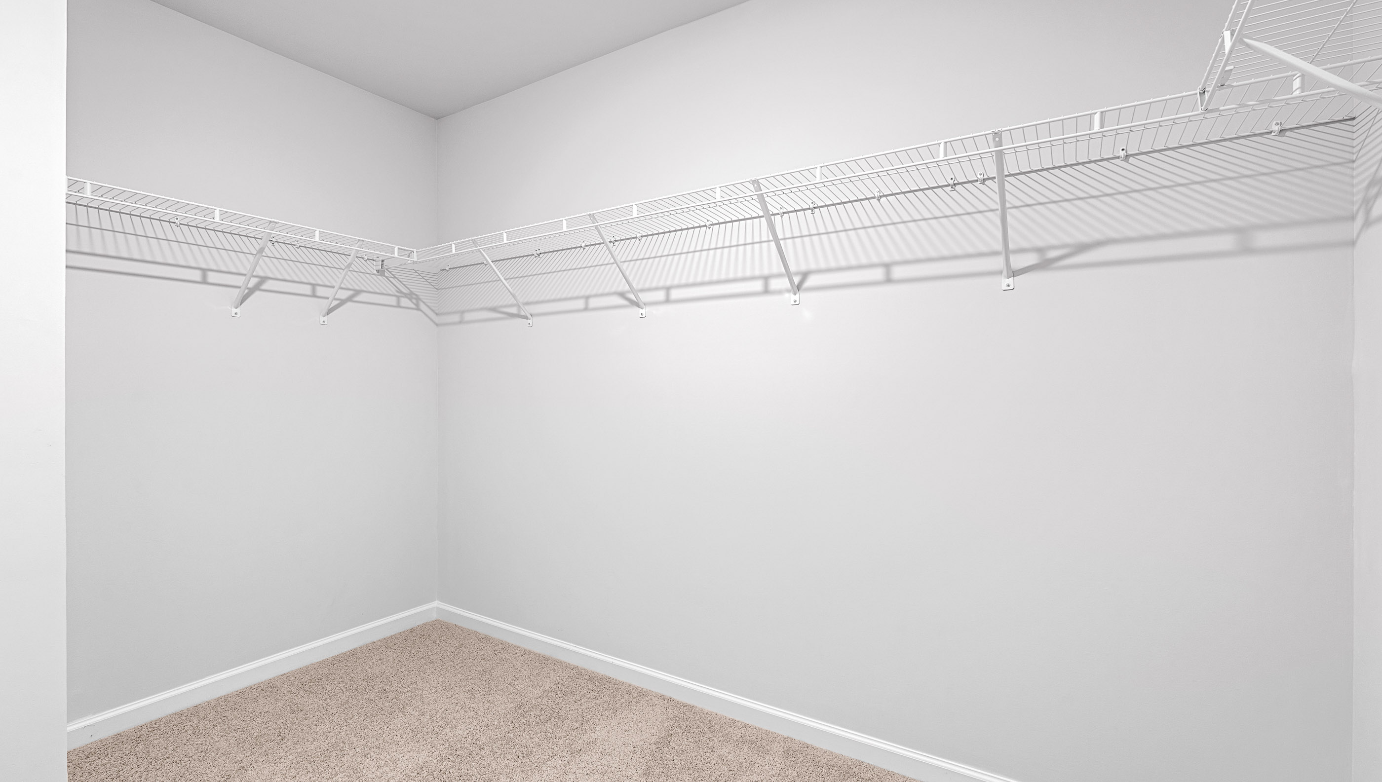 Primary bedroom with shelving.