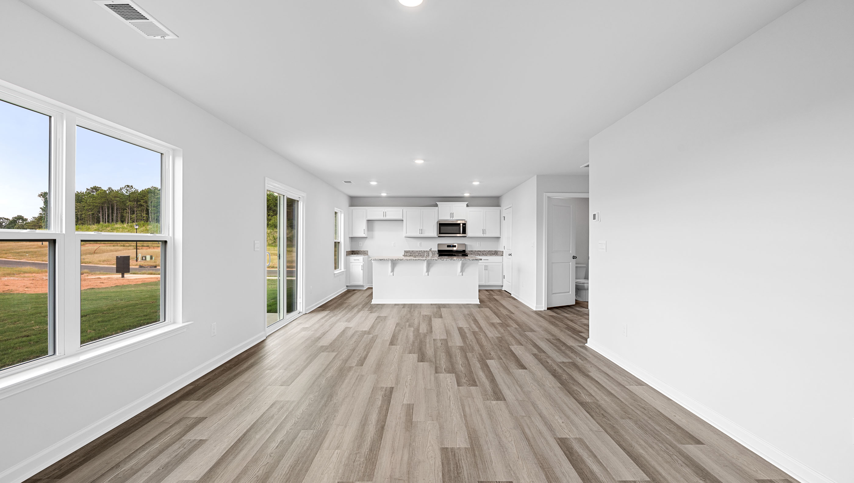 Combination living and dining areas open to the kitchen.