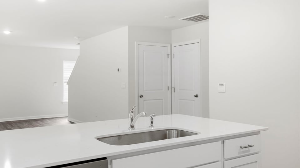 Kitchen with stainless steel appliances.
