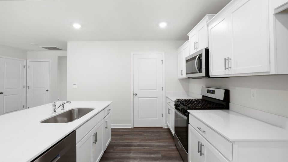 Kitchen with stainless steel appliances.