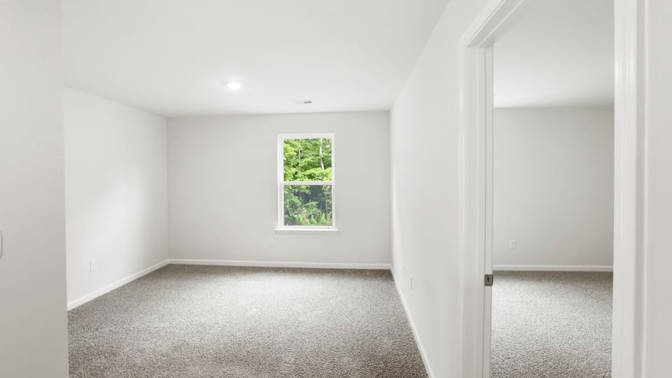 Loft area with carpet.