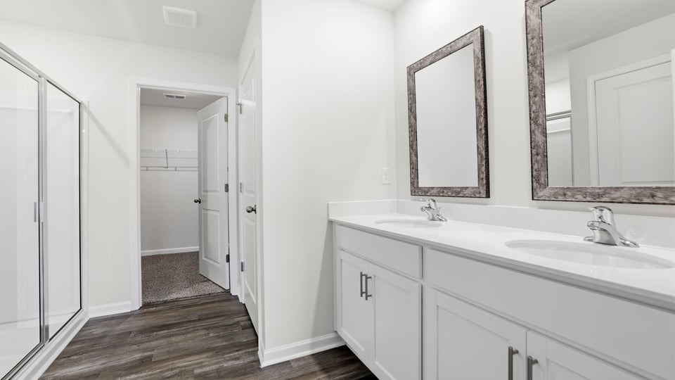 Bathroom with walk in shower and closet.