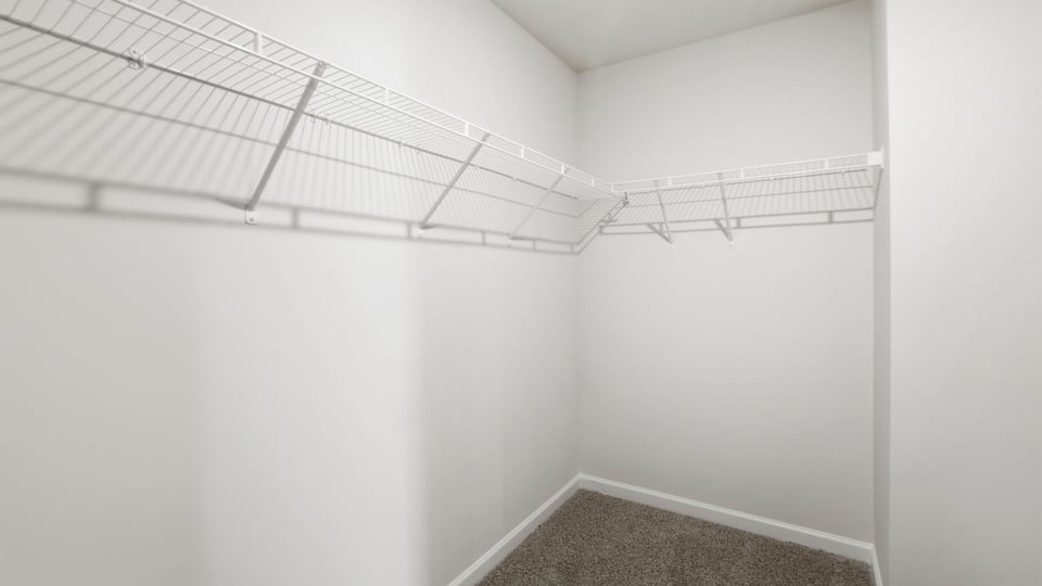 Closet with hanging storage racks.