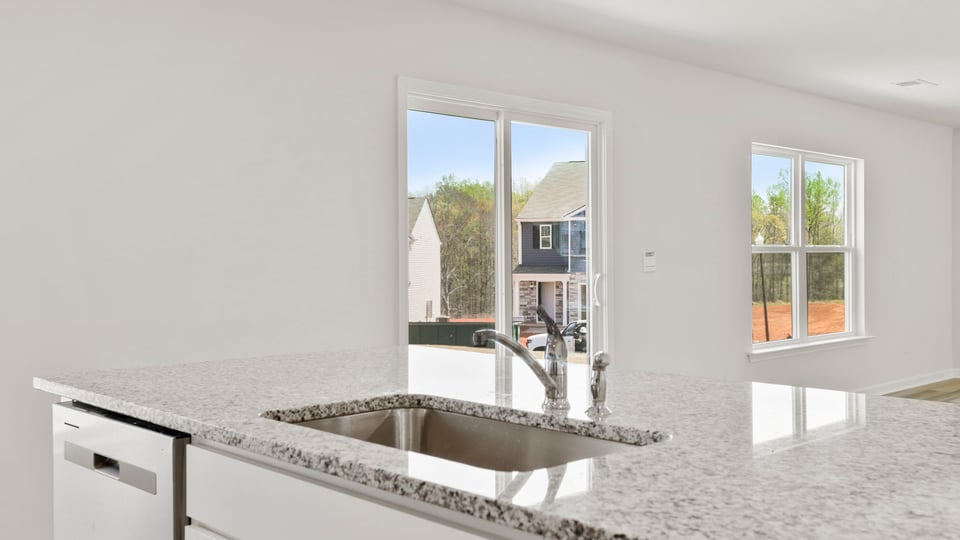 Kitchen with island and cabinets.