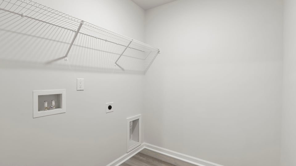 Laundry room with shelf.