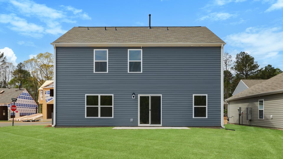 Back exterior with large backyard.