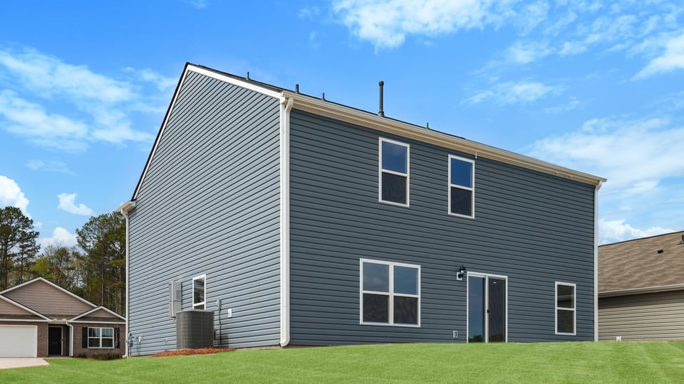 Back exterior with large backyard.