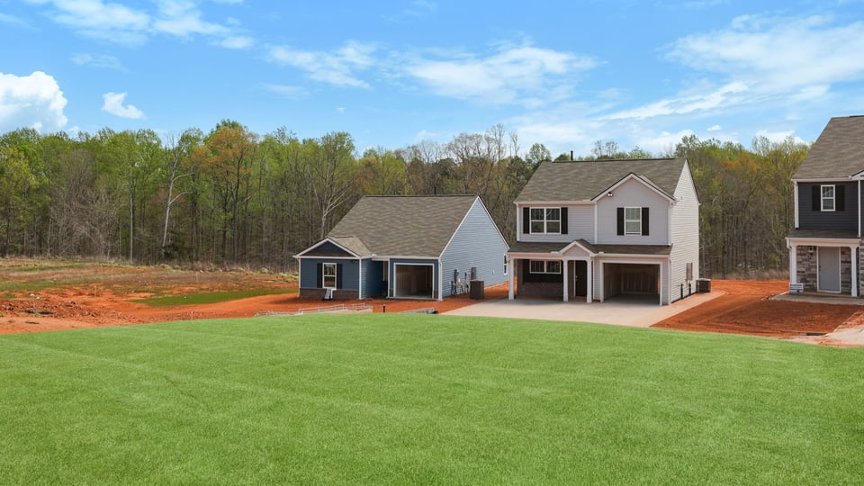 Back exterior with large backyard.