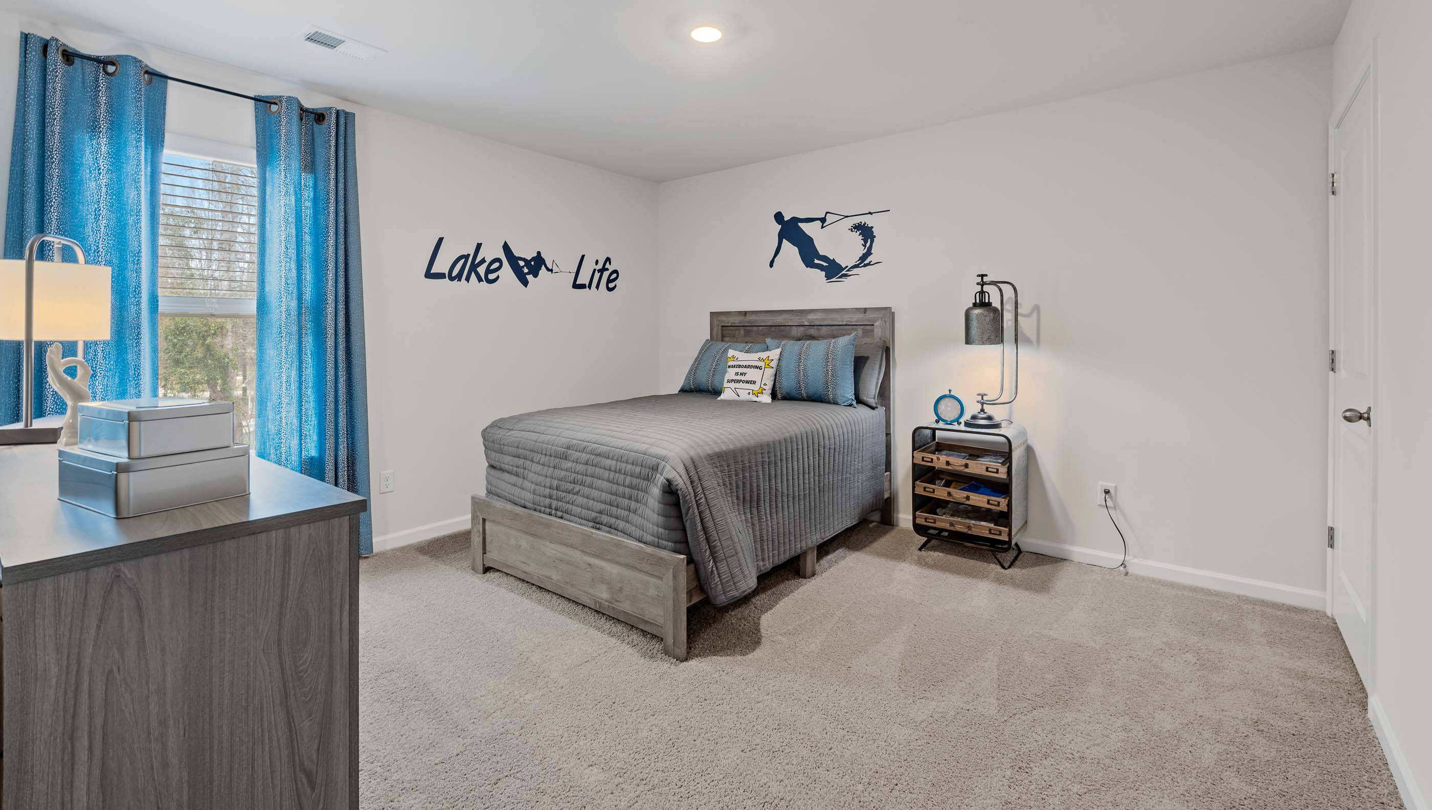Bedroom with carpet and window.
