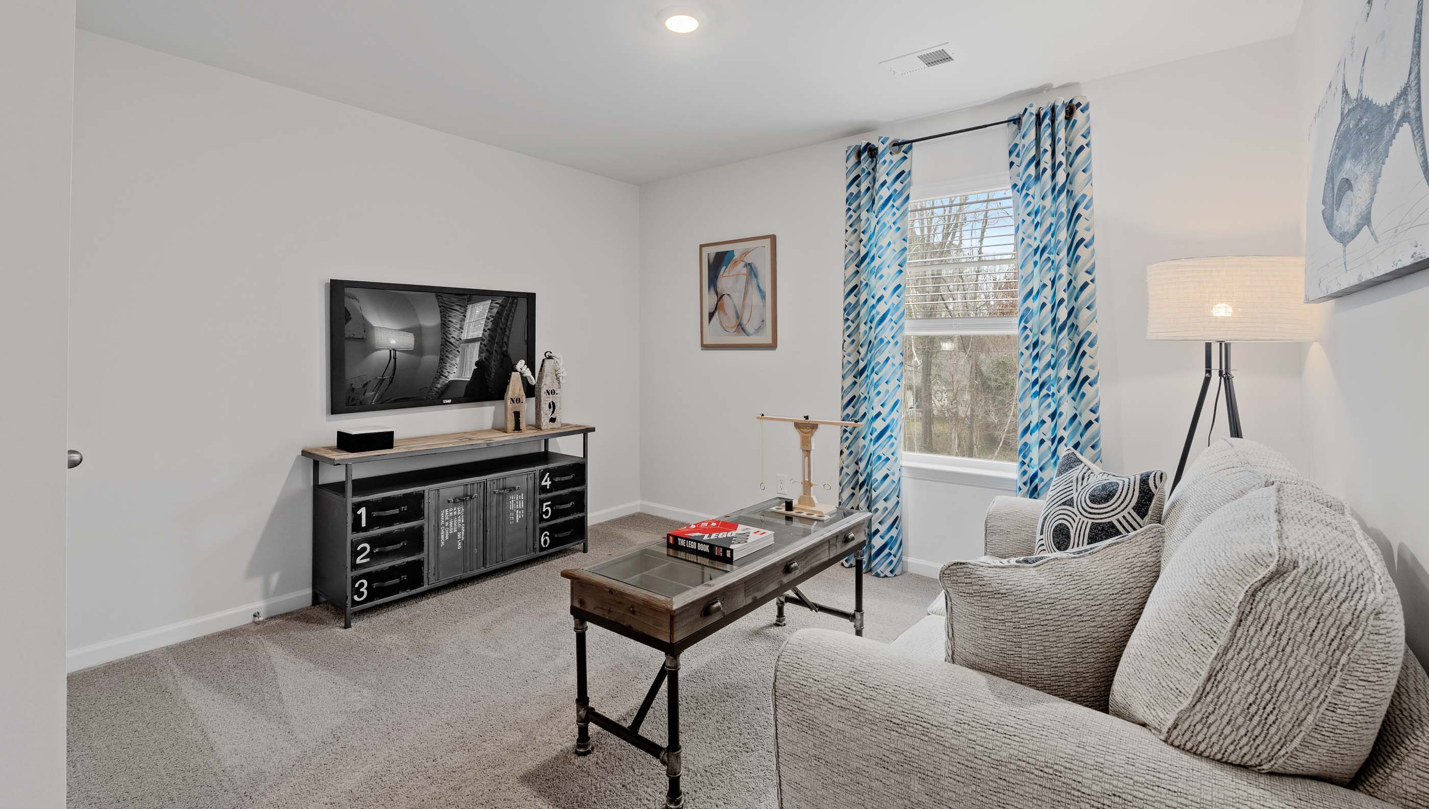 Loft with carpet and window.