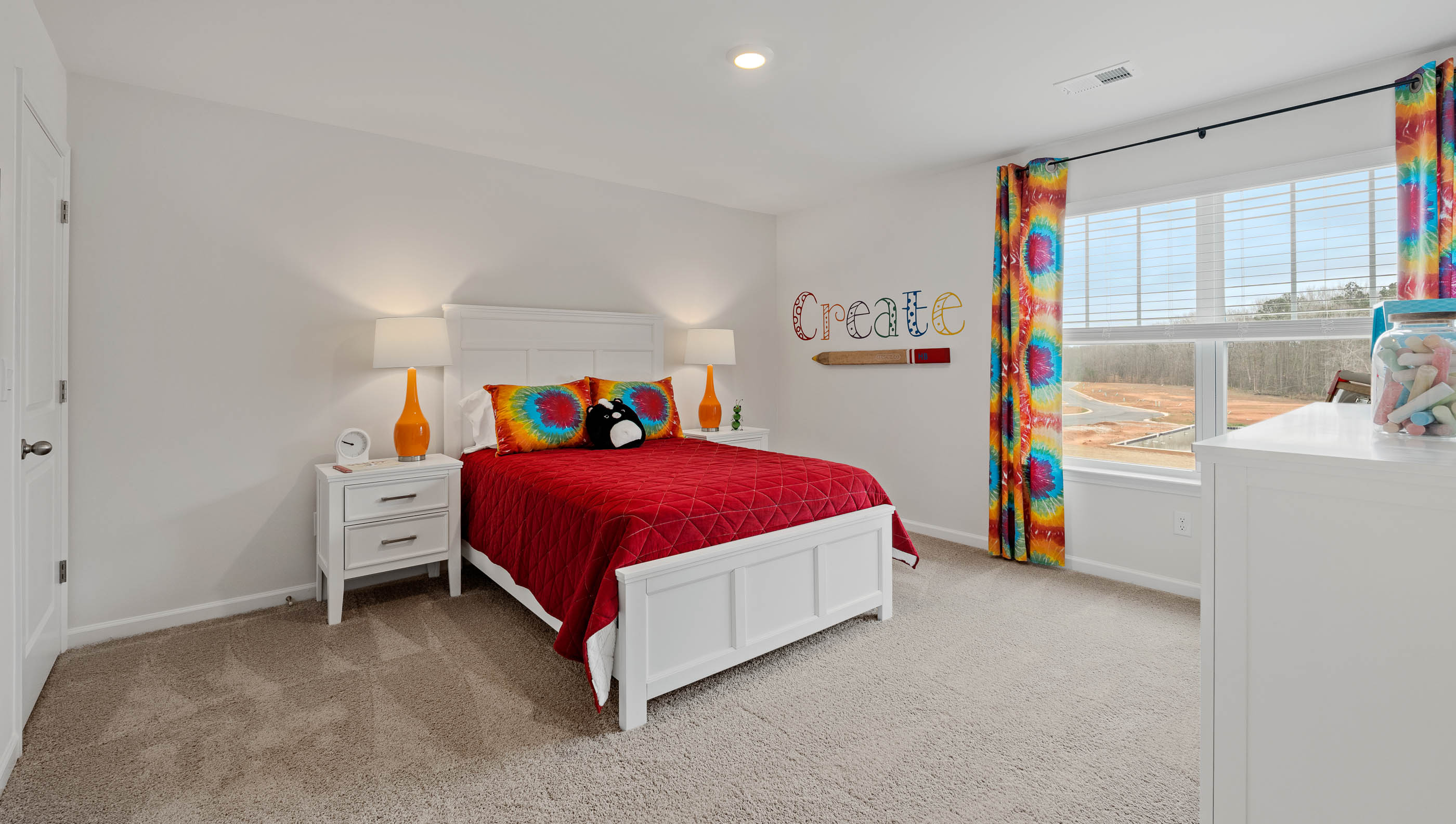 Bedroom with carpet and window.