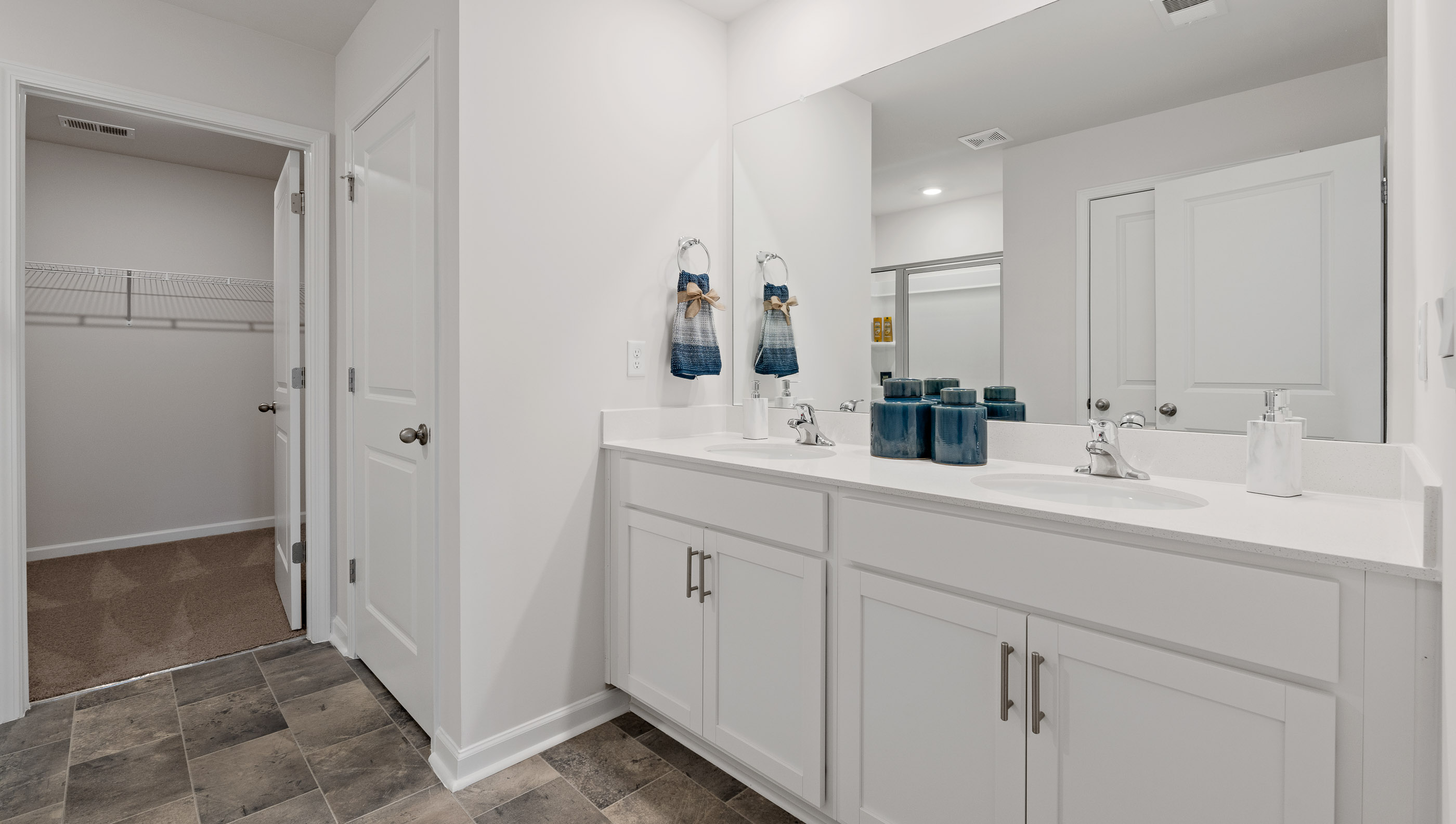 Primary bathroom with double vanity sinks.