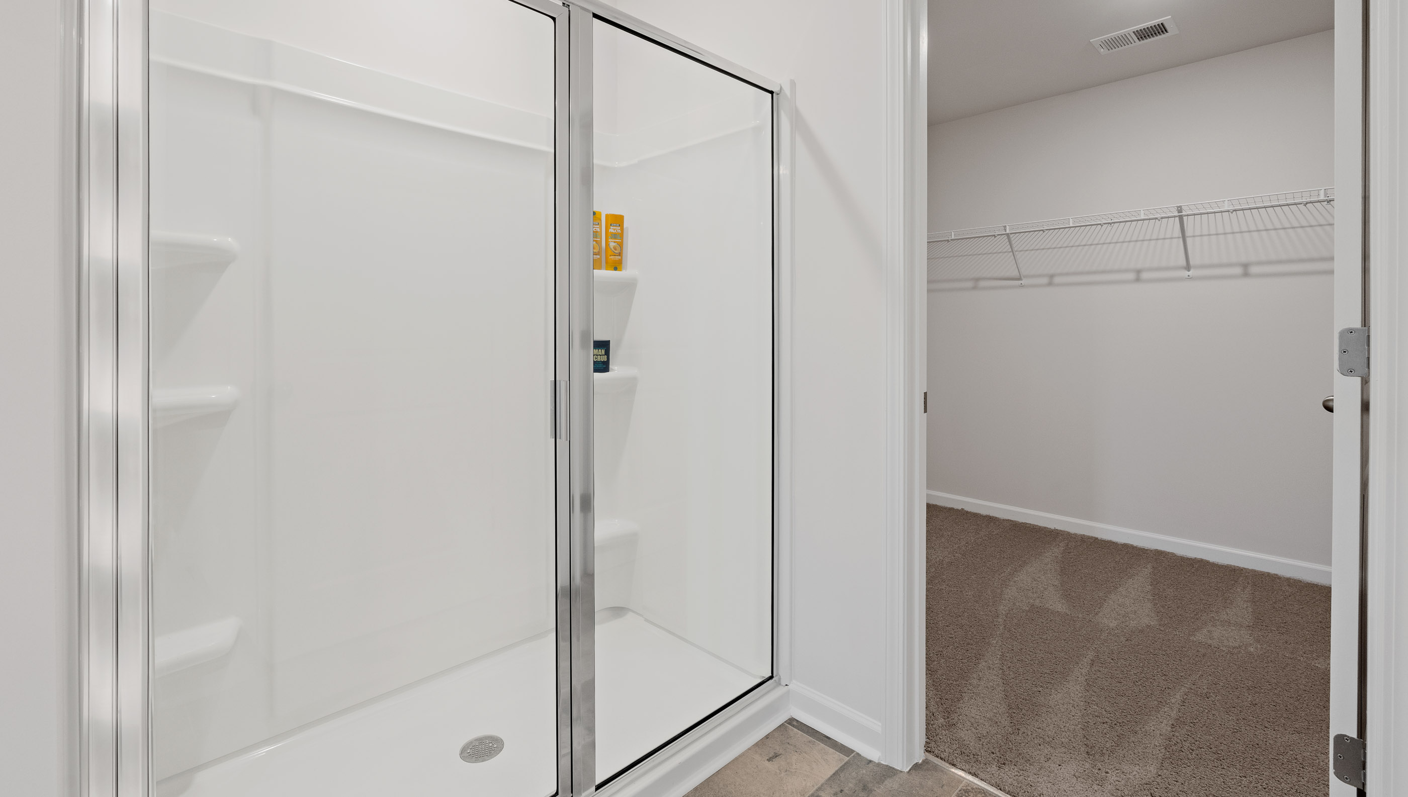 Primary bathroom with double vanity sinks.