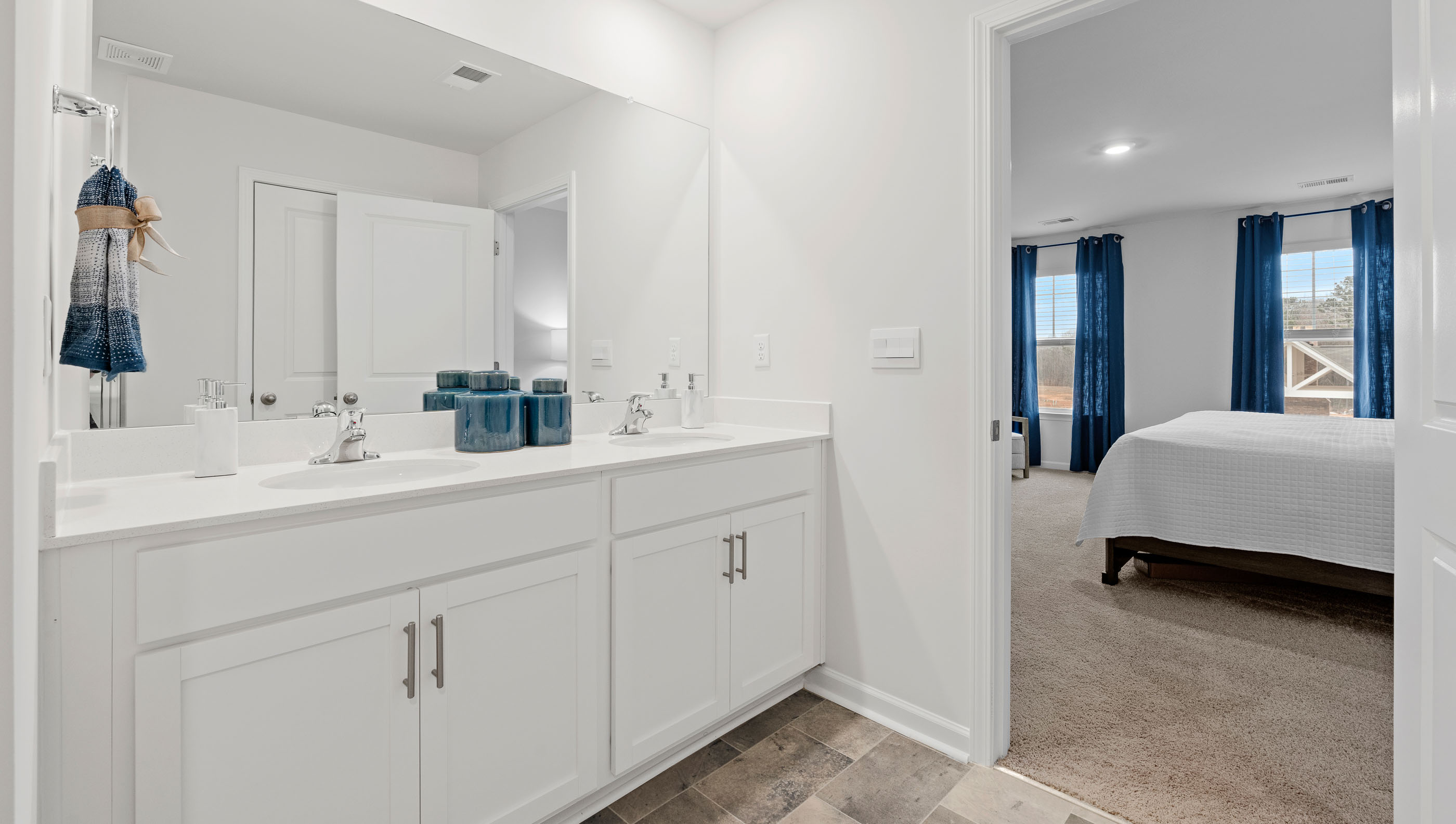 Primary bathroom with double vanity sinks.