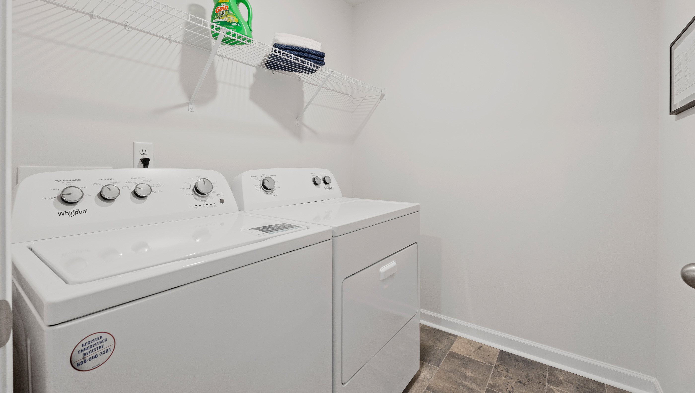 Laundry room with shelf.