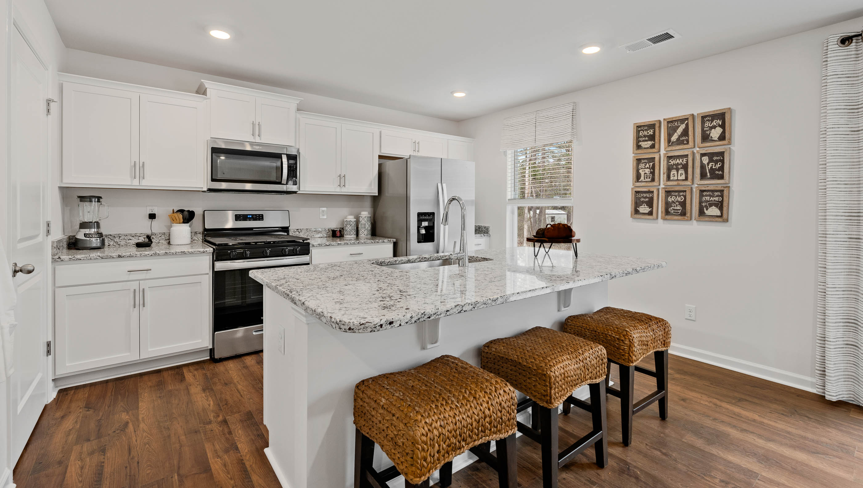 Kitchen with island and cabinets.