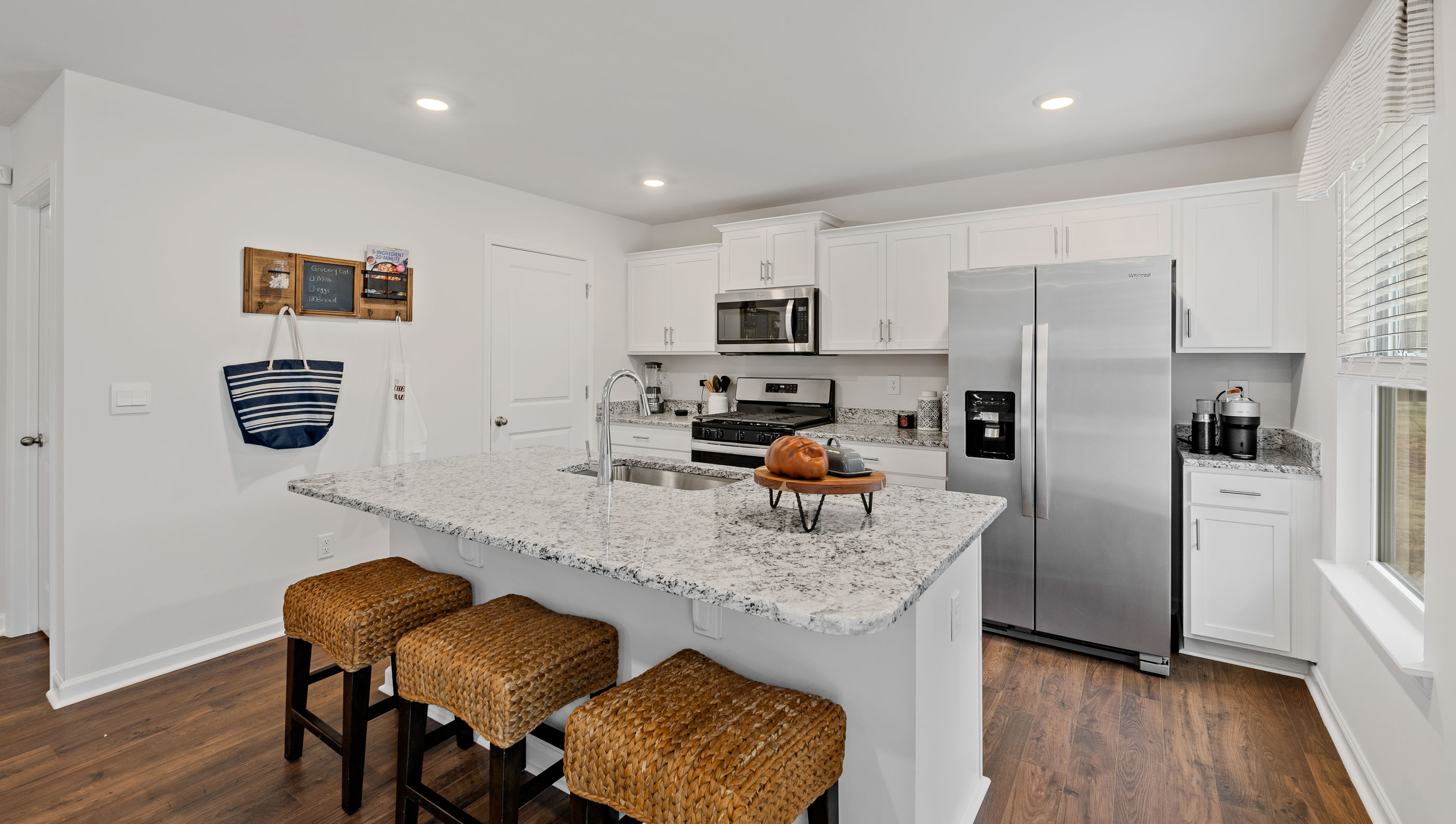 Kitchen with island and cabinets.
