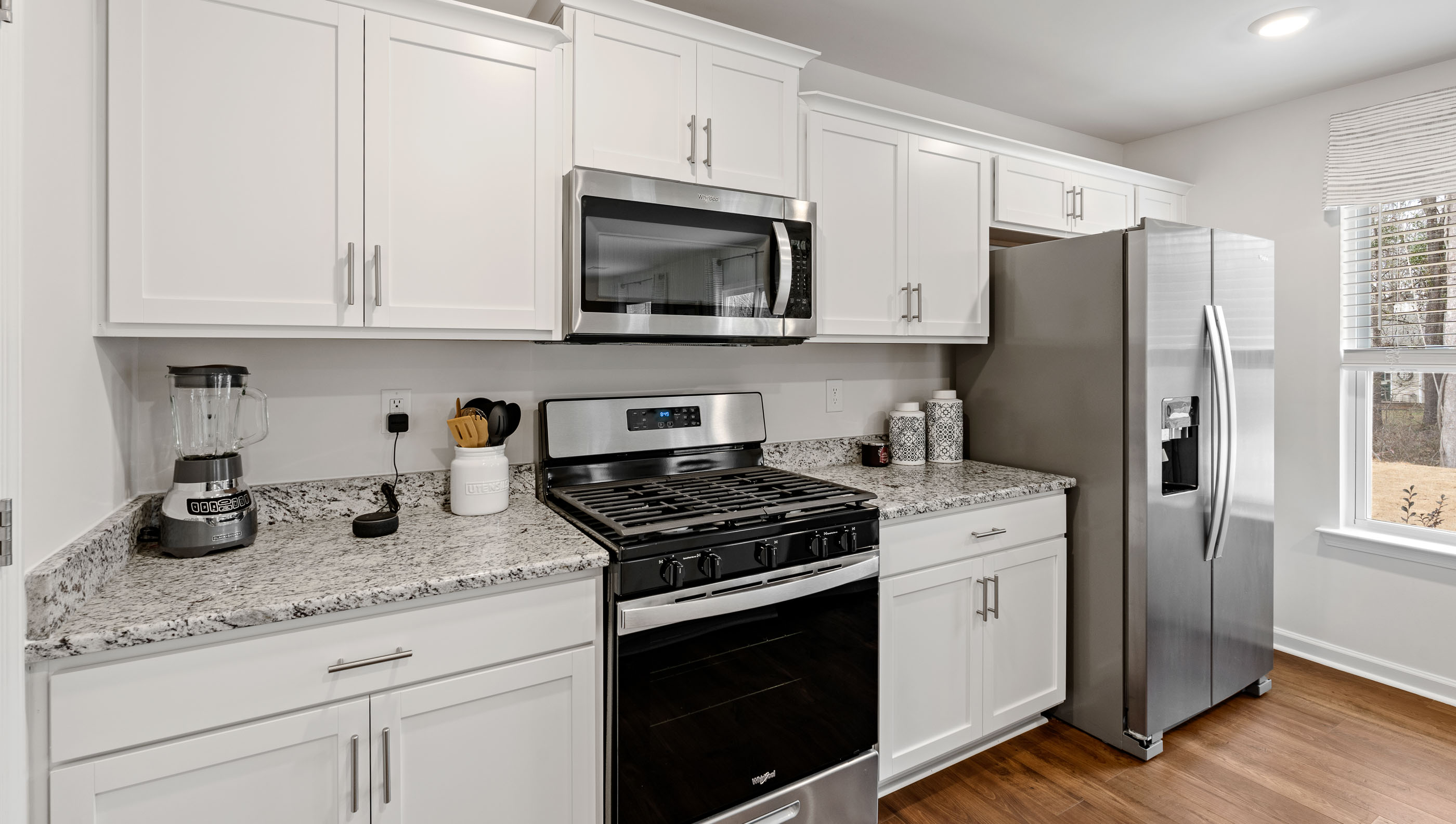 Kitchen with island and cabinets.