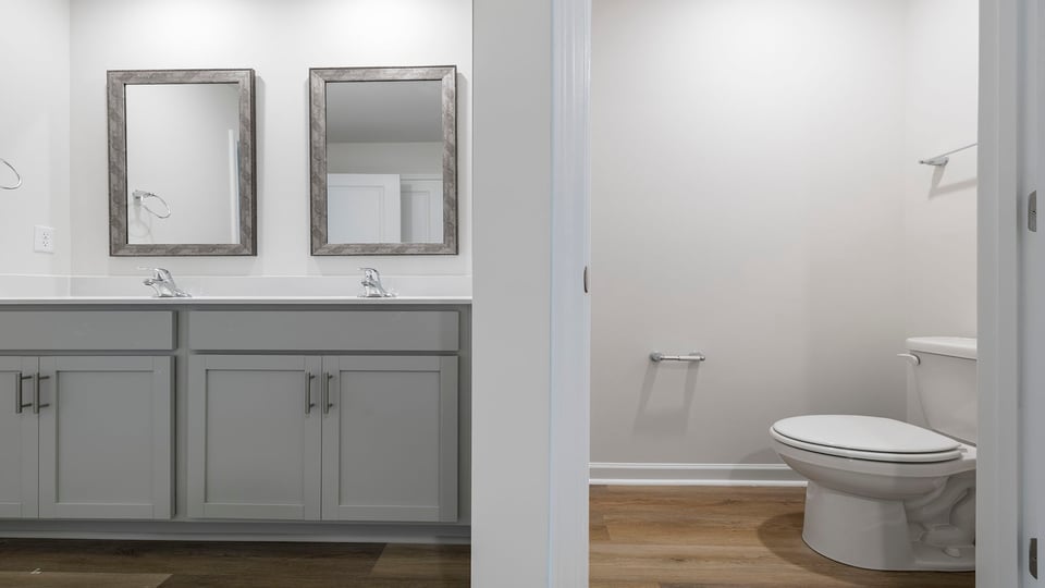 Primary bathroom with double vanity sink.