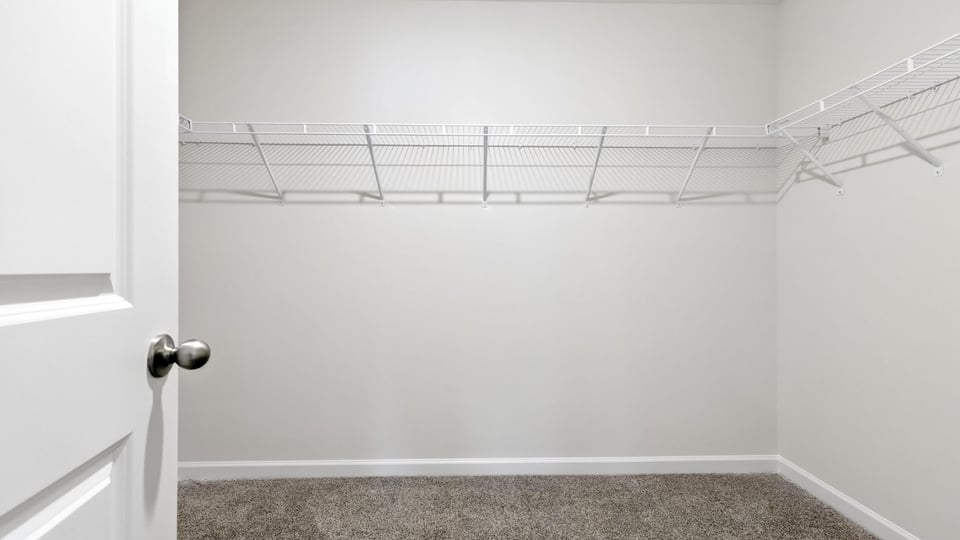Primary closet with shelf/