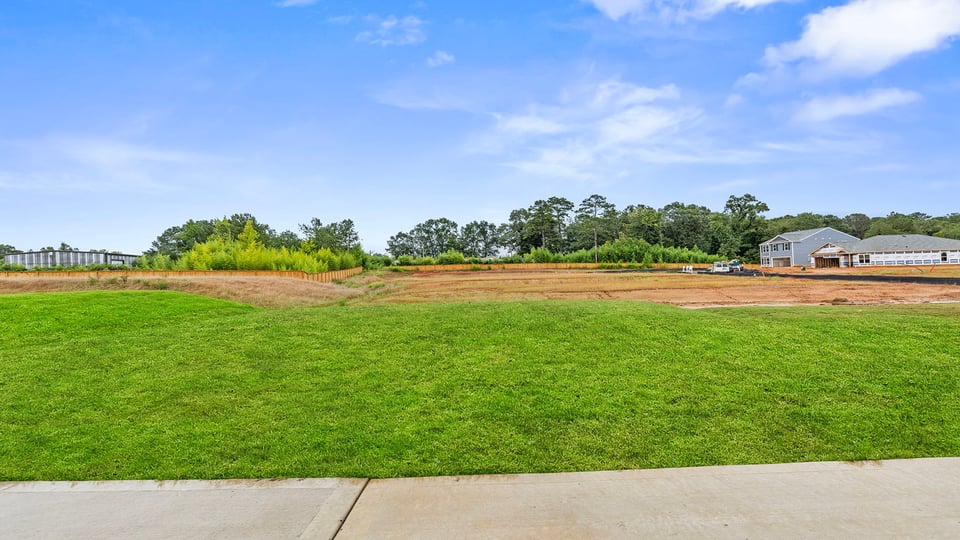 Back exterior with large backyard.