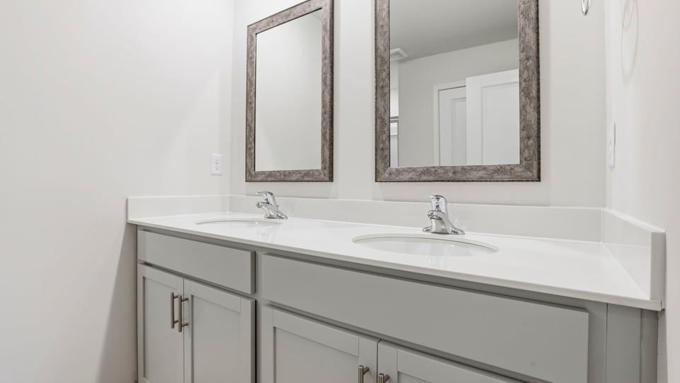 Primary bathroom with dual sink vanity.