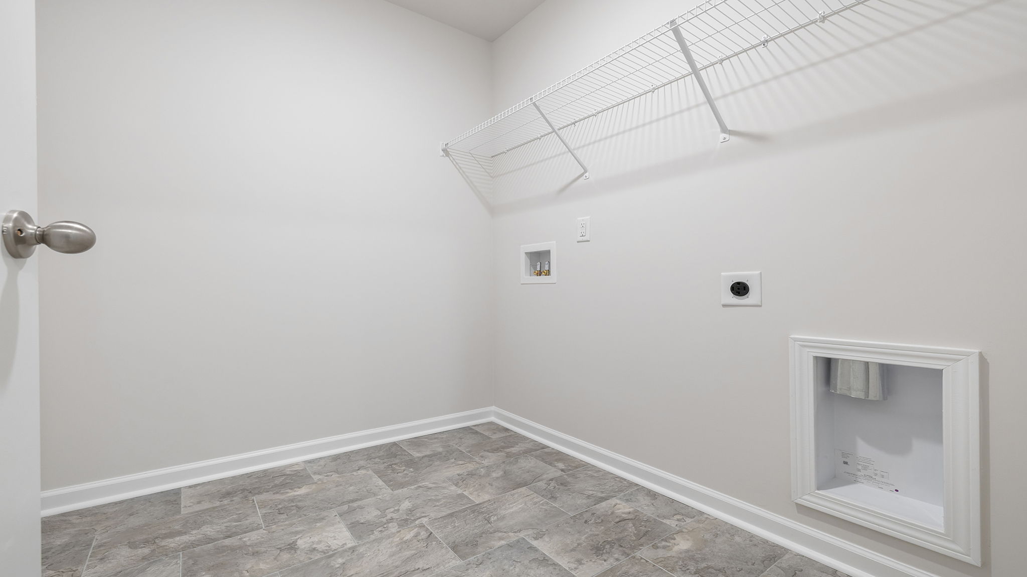 Laundry room with shelving.