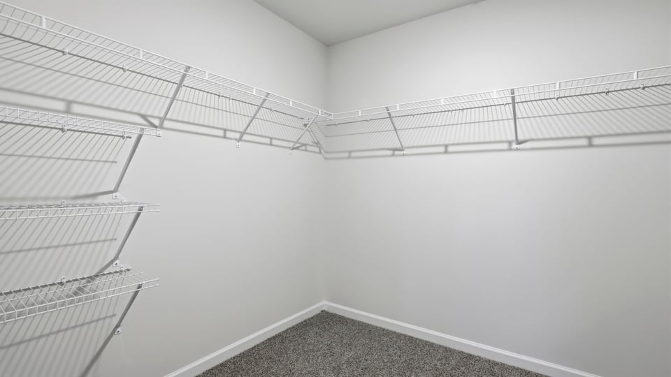 Primary bedroom walk-in closet.