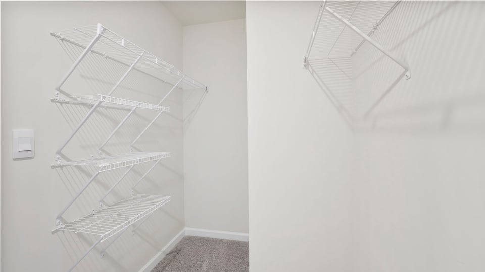 Closet with hanging storage racks.